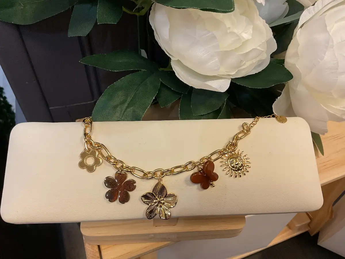 Bracelet breloque floral et soleil